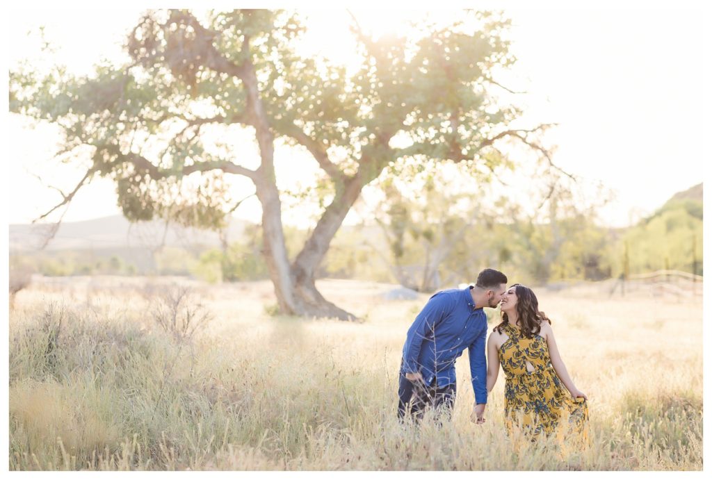 golden hour kisses during Kern County engagement photos
