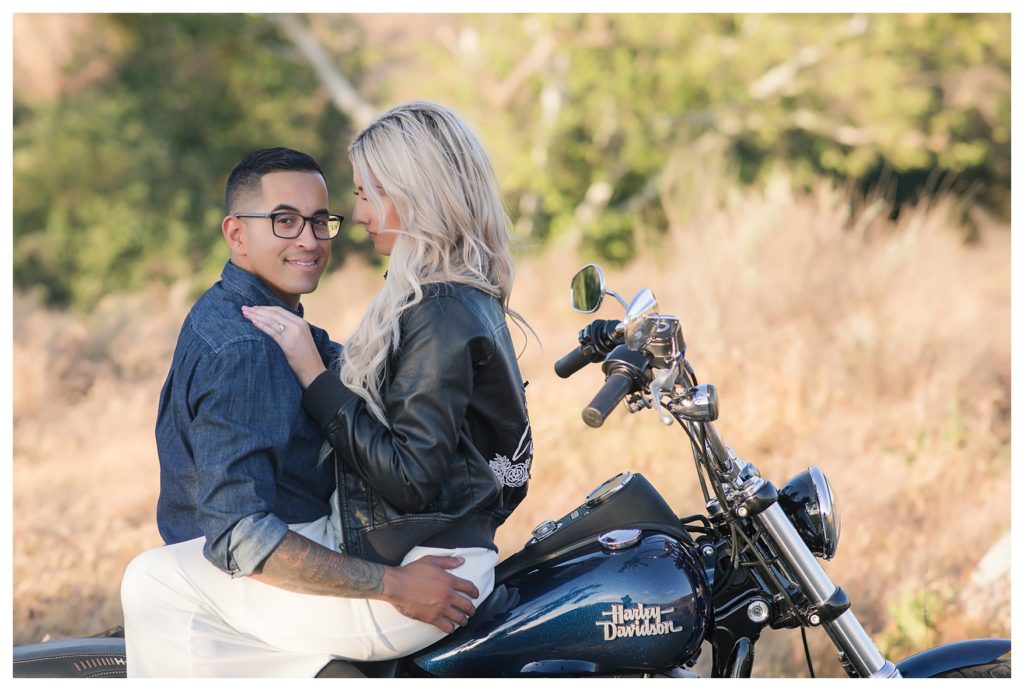 a groom looking cool during his Harley Davidson engagement photos