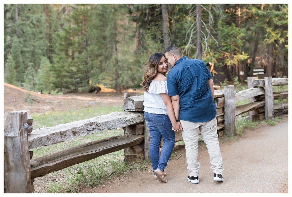 Engagement photos in Sequoia National Park - a couple walking across a bridge