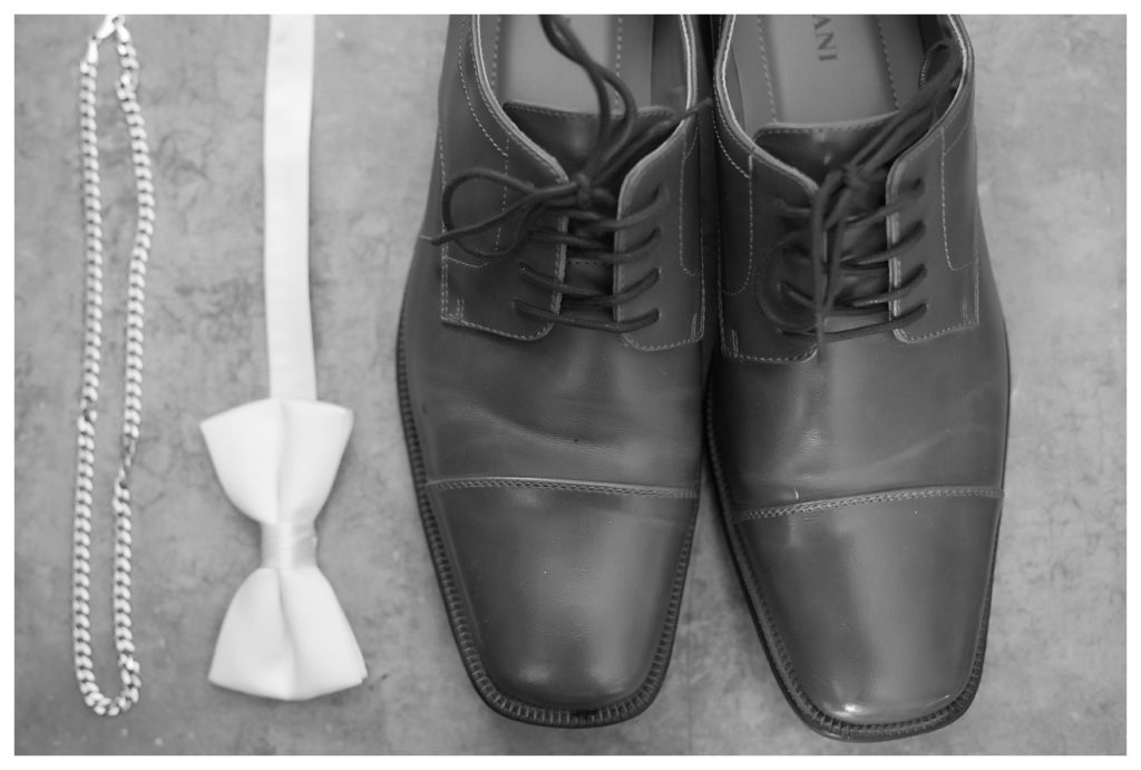 groom's bowtie and wedding shoes