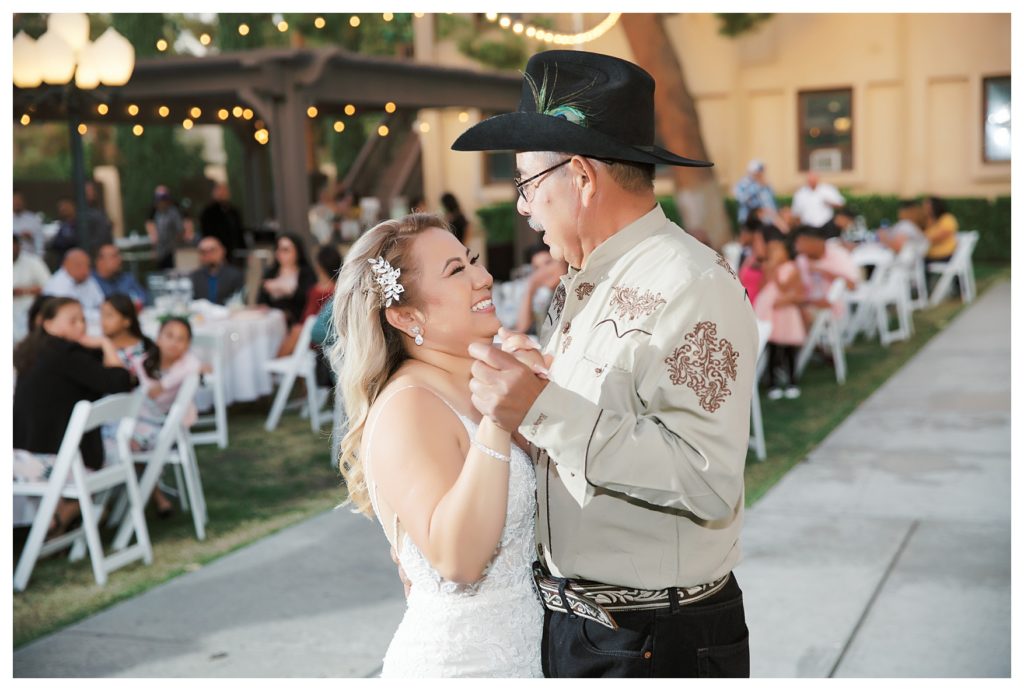bride dances with her father at her wedding at The Gardens at Mill Creek