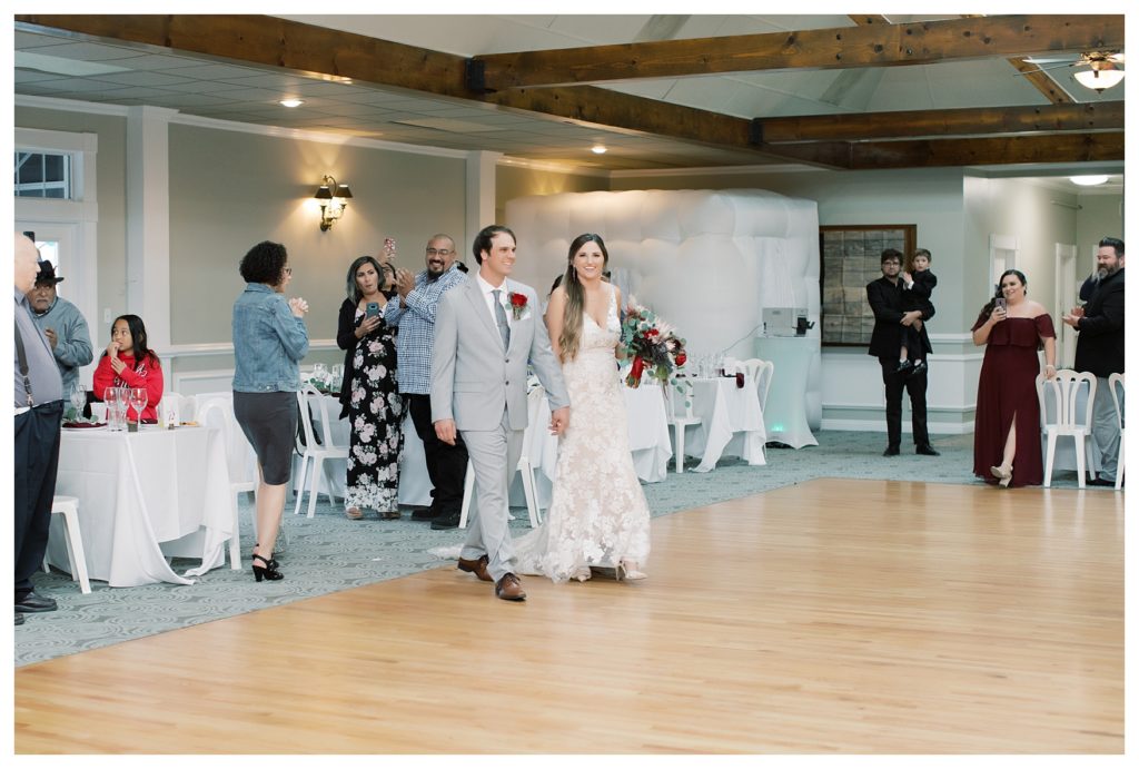 bride and groom enter into the reception of their wedding at Kern County Basque Club