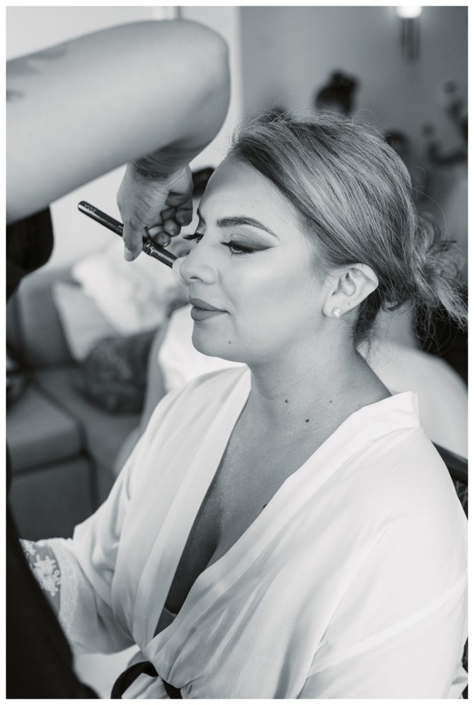 a bride getting makeup done before her Rio Bravo Country Club wedding