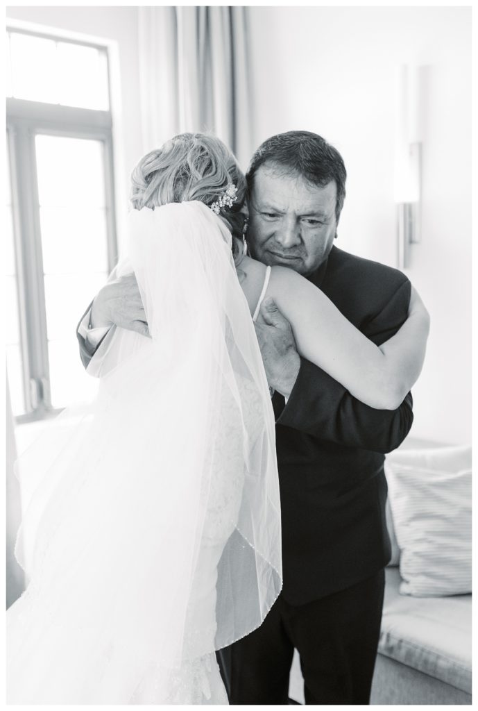 a bride and dad hug before a Rio Bravo Country Club wedding
