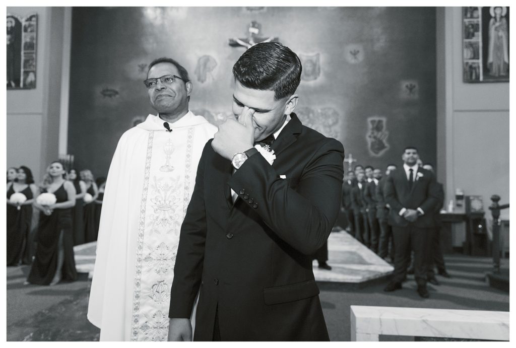 a groom cries as he sees his bride for the first time at their Rio Bravo Country Club wedding