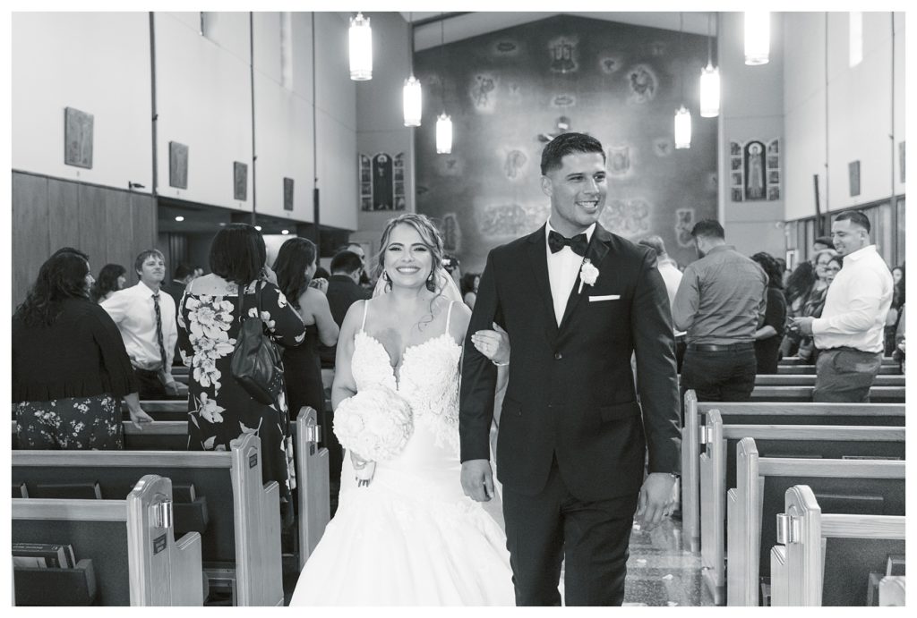 a happy brie and groom exit their ceremony at a Rio Bravo Country Club wedding