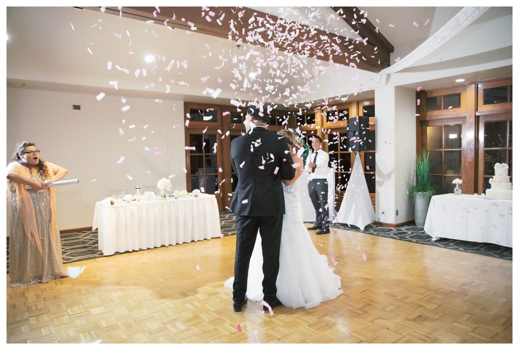 the bride and groom share their first dance under confetti at a Rio Bravo Country Club wedding reception
