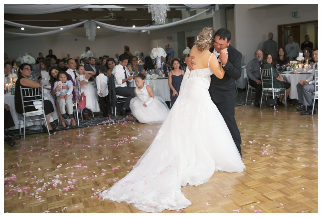 a bride dances with her father at her Rio Bravo Country Club wedding reception