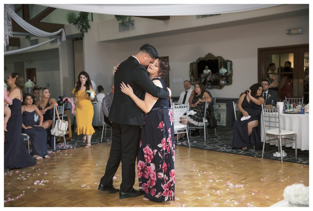 a groom dances with his mother during a Rio Bravo Country Club wedding reception