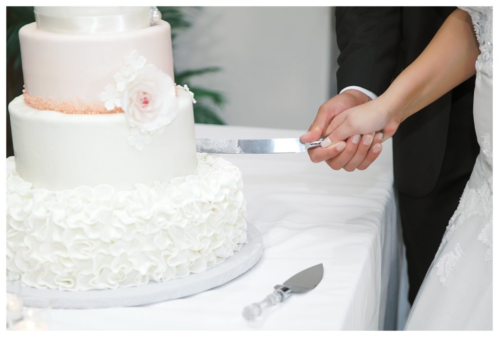 cutting the cake during a Rio Bravo Country Club wedding reception
