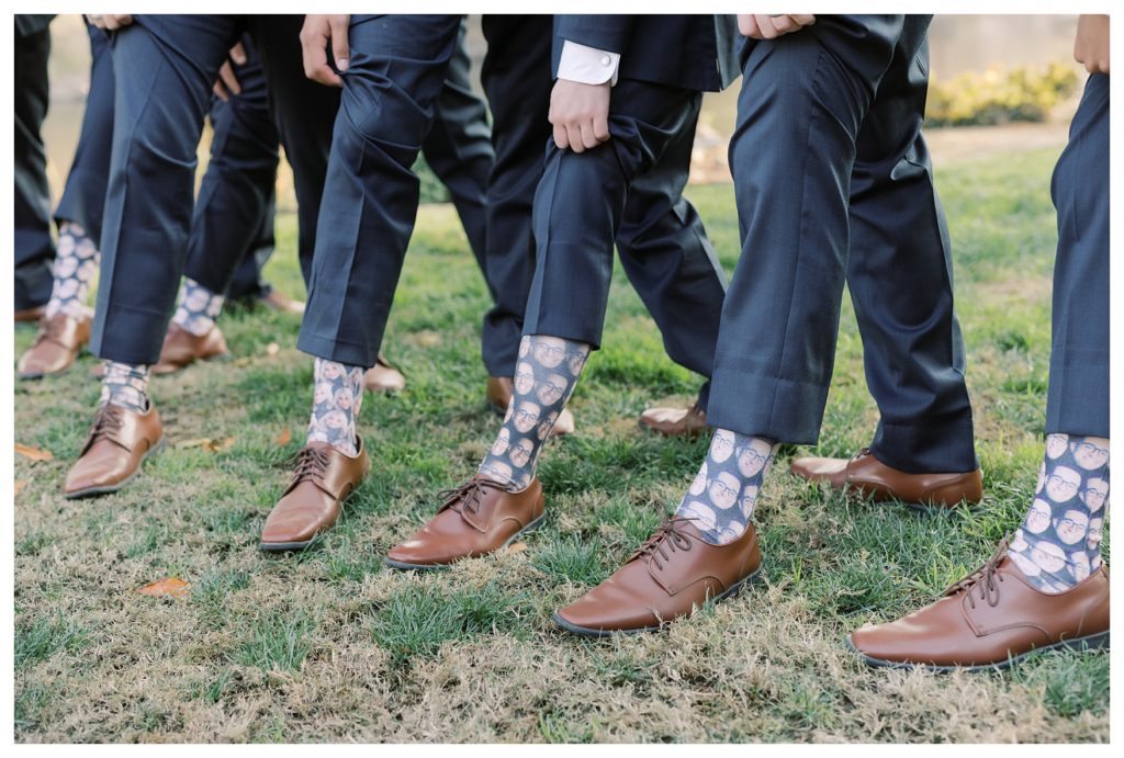 groomsmen wear funny socks for a wedding at JEH Ranch