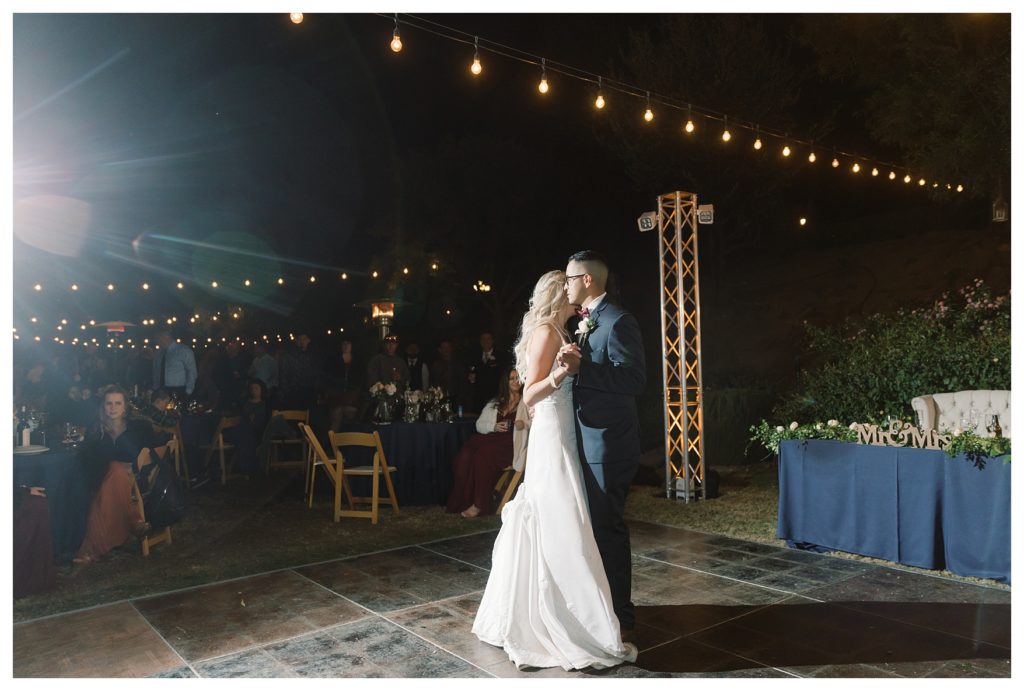 a bride and groom share their first dance as husband and wife at a wedding at JEH Ranch