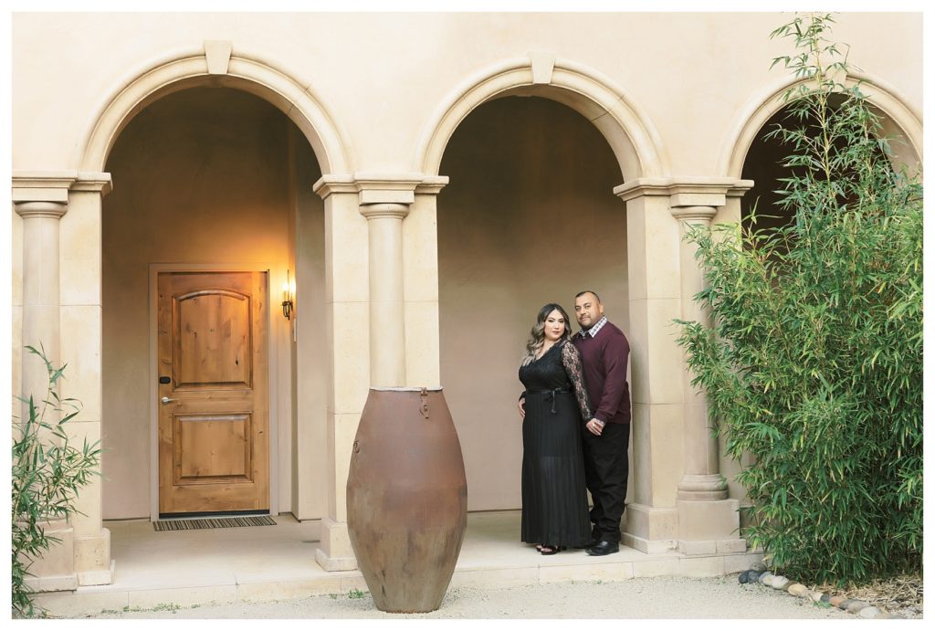 a modern, timeless couple posing during engagement photos at Allegretto Vineyard Resort