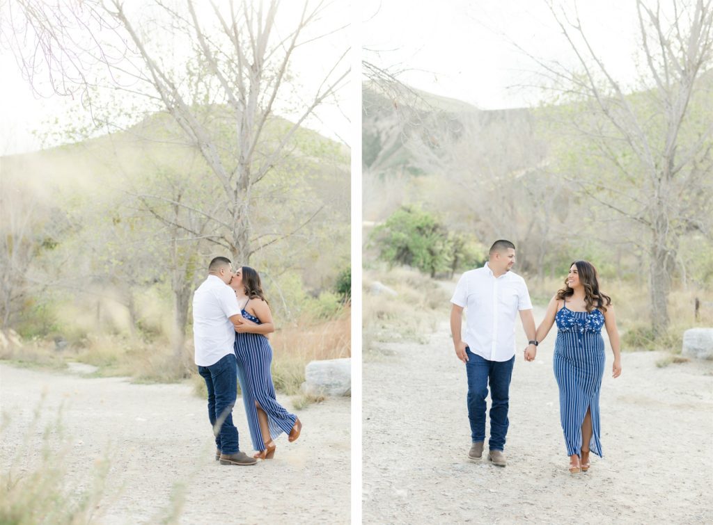 a playful couple walking through the mountains at engagement photos at Wind Wolves Preserve