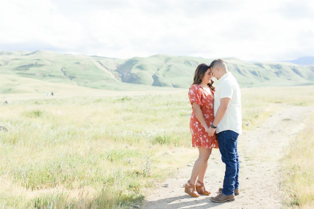 a couple kisses during engagement photos at Wind Wolves Preserve