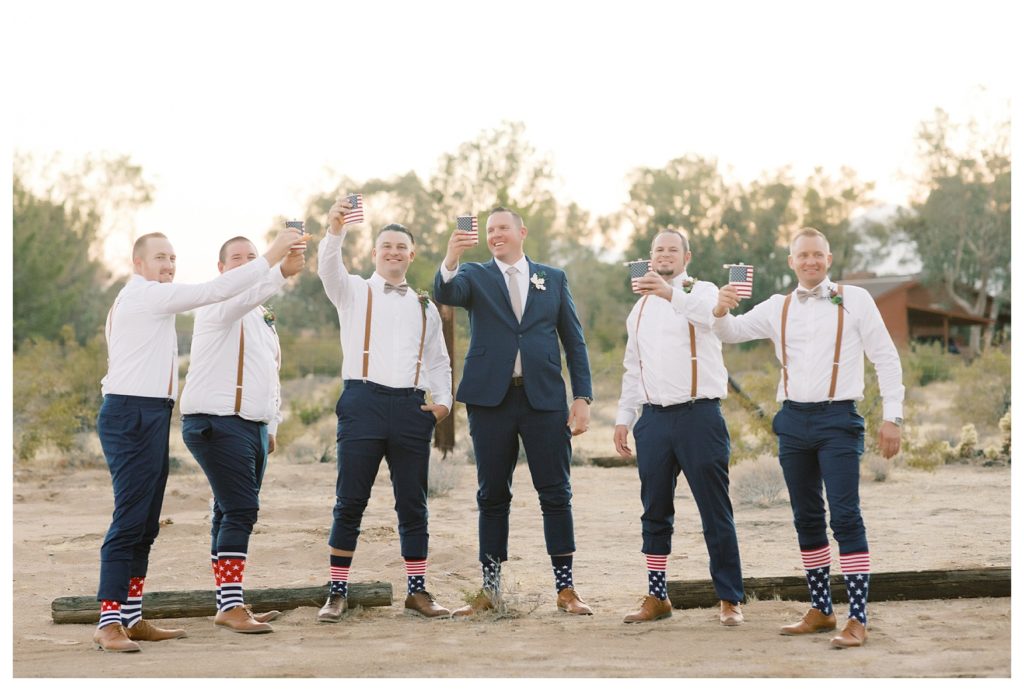 groom and groomsmen toast to a rescheduled COVID wedding