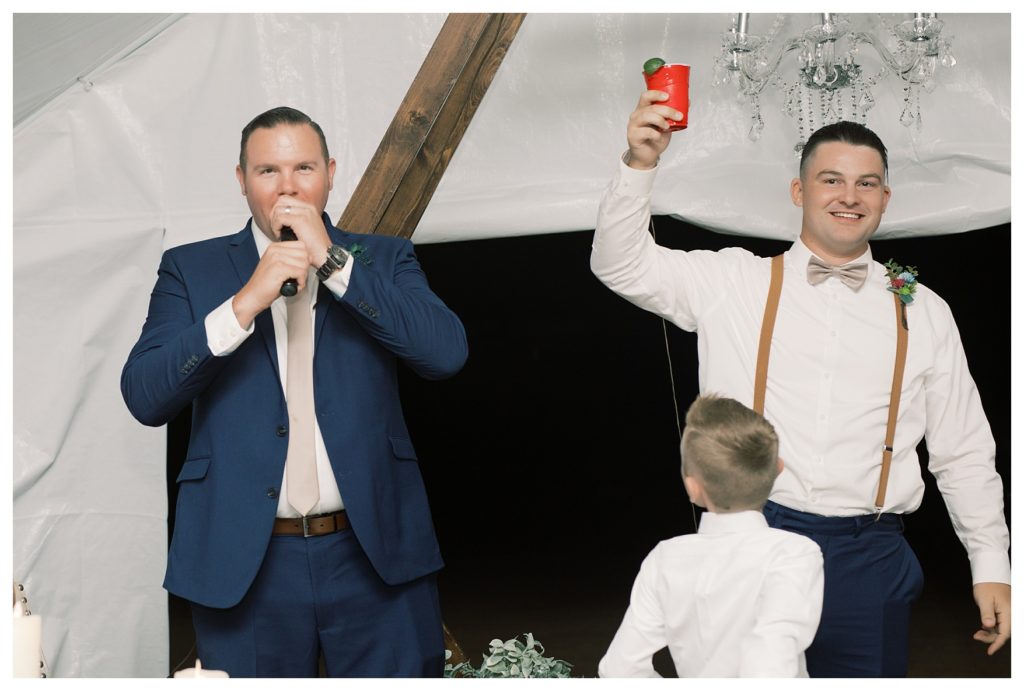 a groom gives a toast at his rescheduled COVID wedding