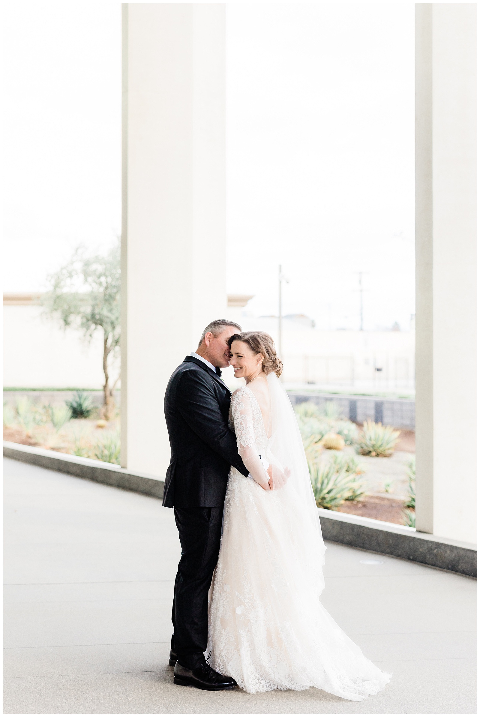 a couple cuddles and hugs after their winter wedding in Bakersfield, CA