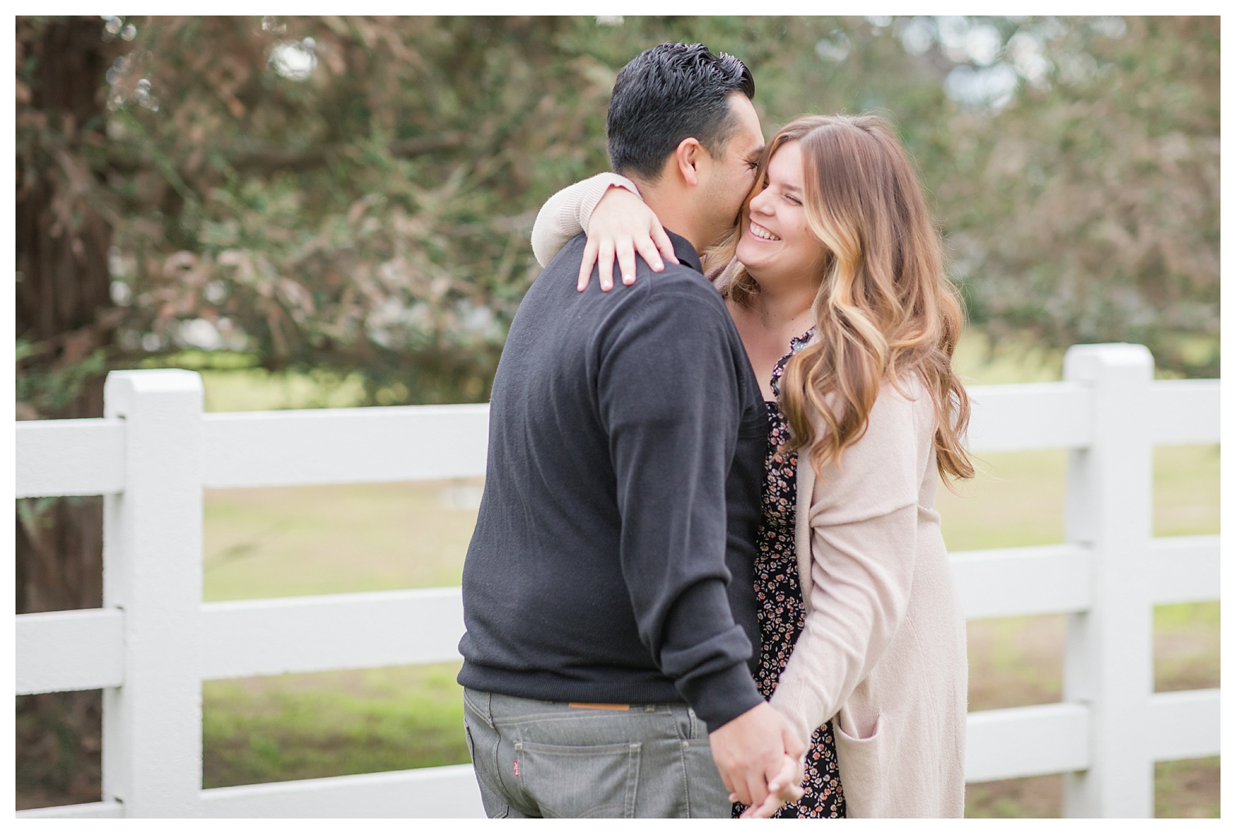 a couple cuddles together during their brisk fall engagement session in Bakersfield, CA