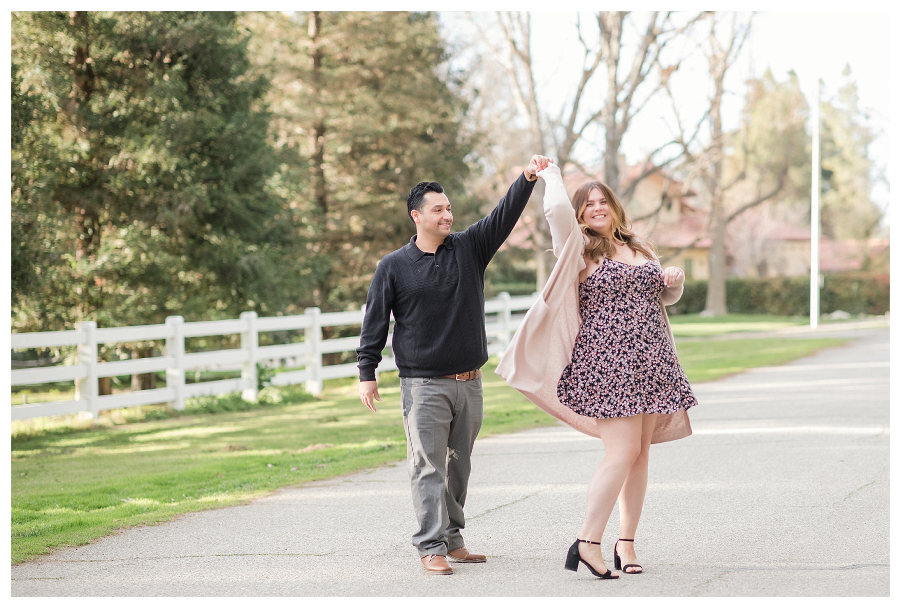 a couple dances during photos at their fall engagement session in Bakersfield, CA