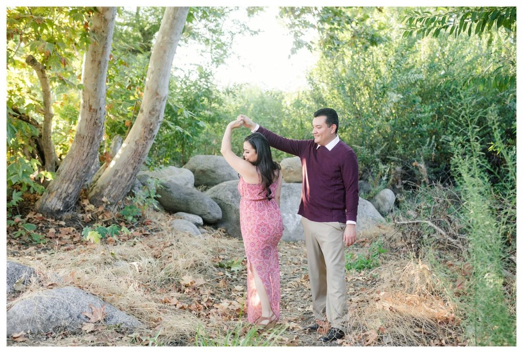 a couple twirling during their engagement session at Kern River